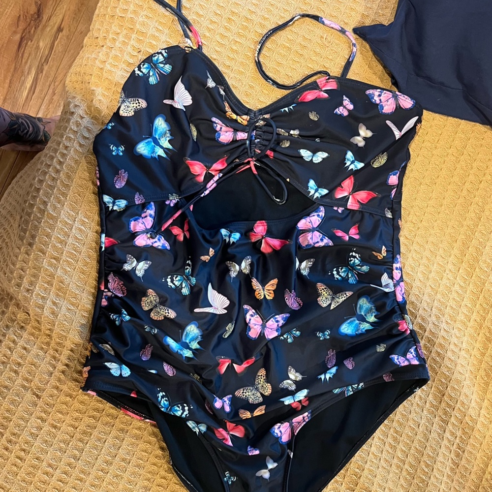 1 black,1 butterfly design one piece and 1 high waisted bottom